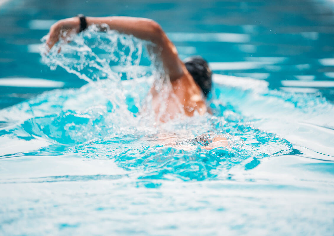 person swimming in pool