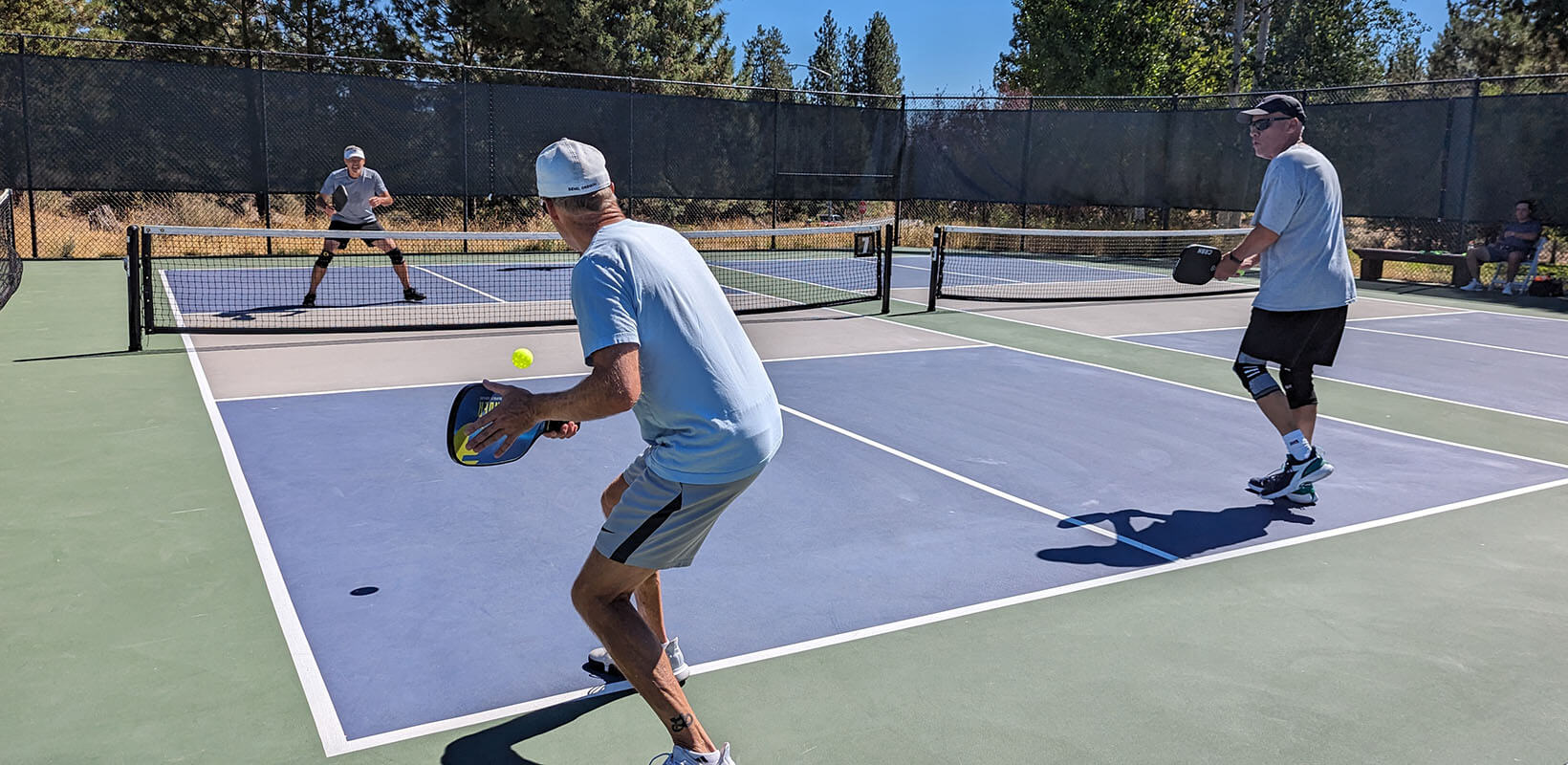 men playing pickleball